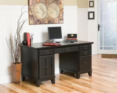 The Arts and Crafts Pedestal Desk is perfect for your home office or anywhere you want to create an attractive workspace. Constructed of solid wood in a warm cottage oak finish, this desk offers generous storage. The left side has a small upper drawer and a lower cabinet for CPU storage, and the right side offers two small drawers and a lower file drawer. The front of the center drawer drops down to reveal a pullout keyboard tray. The spacious desktop allows you to work with ease and can accommodate a desktop or laptop computer. Assembly required. Dimensions: 58W x 28D x 30H inches. About Homestyles Homestyles is a manufacturer and distributor of ready-to-assemble (RTA) furniture perfectly suited to today's lifestyles. The great difference between Homestyles and many other RTA furniture manufacturers is that all Homestyles pieces are crafted of solid wood, an important quality. When shopping for convenient, durable items for the home, look to Homestyles. You'll appreciate the value.