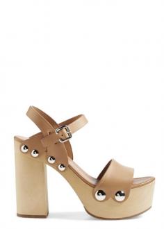 
                        
                            Head over heels for these retro-chic Prada platform sandals.
                        
                    