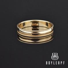 Outstanding elegant 10K yellow gold wedding band ring. Done in an eternity band Art Deco style, the simple band, has a smooth rounded center with a milgrain border on the top and bottom. Perfect for adding to a diamond engagement ring, wearing as a wedding band or for stacking with other rings