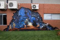 An exterior backyard Star Wars Graffiti mural, painted at a private location. This outdoor wall is for die hard star wars fan. Due to the shape of the wall and limited space, a pyramid composition was used to help centre Darth Vader and the characters battle scene. The Star Wars collage displays some of the main features in this epic film. Such as; Characters, Darth Vader, Darth Maul vs Qui-Gon Jinn, R2d2, C-3po. And scenery with X-wings and Tie fighters. Creating a scene as if the fighters are sitting 3d on the wall, gives great depth to the piece. Like it is encapsulated behind the brickwork, kind of like looking through a window.
