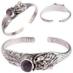 Dragon Cuff Bracelet with Faceted Oval-Cut Amethyst as the Brooch

This designer dragon amethyst bracelet is one of the most unique styles of creativity that we at Exotic India make you avail of. Having the bands designed in utmost precision depicting the lavish body of a dragon, with the scales carved all over in layers that descend in number as it goes down. A similar stylized pattern can be seen on the other side as well. The sterling silver base adds to the charm of this bracelet with even the minutest chisels clearly visible and the superfine dragon face that seems to eat the faceted oval amethyst stone in the centre forms a great brooch to this elegant bracelet.

Amethyst Dragon Cuff Bracelet: https://www.exoticindiaart.com/product/jewelry/dragon-cuff-bracelet-with-faceted-oval-cut-amethyst-as-brooch-adjustable-size-LCI83/

Amethyst: https://www.exoticindiaart.com/jewelry/stone/amethyst/

Stone: https://www.exoticindiaart.com/jewelry/stone/

Jewelry: https://www.exoticindiaart.com/jewelry/

#jewelry #stones #amethyststone #dragoncuffbracelet #bracelet #fashion #traditional