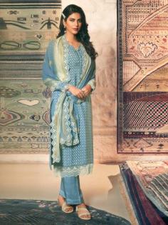 The soft feel of crepe fabric is made softer in this Cyan blue salwar kameez- an ideal fashion choice if you want your everyday style to look special. The kameez is decorated with ethnic dots and the dupatta looks immensely beautiful with a golden and lace and crochet border, which is also added to the kameez.