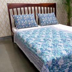 Explore the charm of Indian patchwork quilts online at Roopantaran. Our collection showcases exquisite cotton quilts with intricate designs and vibrant colors, encapsulating the essence of traditional craftsmanship. Transform your bedding with these unique and cozy quilts that narrate tales of Indian artistry.